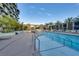 Inviting pool area with palm trees and comfortable lounge seating for relaxation and enjoyment at 353 E Bonneville Ave # 313, Las Vegas, NV 89101
