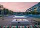 Beautiful pool area at dusk, featuring a cozy fire pit and stylish lounge furniture at 353 E Bonneville Ave # 313, Las Vegas, NV 89101