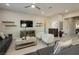 Relaxing living room featuring comfortable seating and large TV at 5864 Sky Ridge Falls Dr, Las Vegas, NV 89135