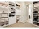 Well-organized walk-in closet with custom shelving and drawers at 5864 Sky Ridge Falls Dr, Las Vegas, NV 89135