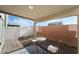 Small backyard patio with table and chairs at 6271 Port Astoria Ct, Las Vegas, NV 89122
