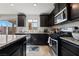 Modern kitchen with stainless steel appliances and granite countertops at 6271 Port Astoria Ct, Las Vegas, NV 89122