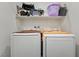 Laundry room with washer, dryer, and shelving at 6271 Port Astoria Ct, Las Vegas, NV 89122