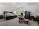 Bright main bedroom featuring a king-size bed and window at 6271 Port Astoria Ct, Las Vegas, NV 89122