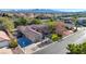 Aerial view of a house with a boat in the driveway and a landscaped yard at 10758 Chillingham Dr, Las Vegas, NV 89183