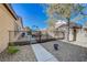 Landscaped backyard with walkway and gate access at 10758 Chillingham Dr, Las Vegas, NV 89183