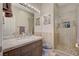 Elegant bathroom with a walk-in shower and modern vanity at 10758 Chillingham Dr, Las Vegas, NV 89183