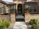 Elegant entrance with iron gate and landscaping at 10758 Chillingham Dr, Las Vegas, NV 89183