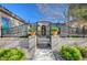 Elegant entry gate with ornate ironwork and landscaping at 10758 Chillingham Dr, Las Vegas, NV 89183