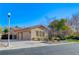 House exterior showcases a three-car garage and manicured lawn at 10758 Chillingham Dr, Las Vegas, NV 89183