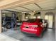 Garage with Tesla and Jeep, plus storage cabinets at 10758 Chillingham Dr, Las Vegas, NV 89183