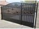 Ornate iron gate with rose detail, adds curb appeal at 10758 Chillingham Dr, Las Vegas, NV 89183