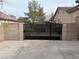 Black iron gate with decorative roses, adds curb appeal at 10758 Chillingham Dr, Las Vegas, NV 89183