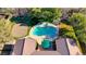 An elevated view of a luxurious backyard oasis featuring a sparkling pool and putting green at 10758 Chillingham Dr, Las Vegas, NV 89183