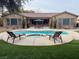 Inviting pool and spa with lounge chairs at 10758 Chillingham Dr, Las Vegas, NV 89183