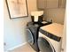 Convenient laundry room with washer, dryer, and storage at 112 Antler Square Ln, Henderson, NV 89011