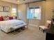 Bright bedroom with plush bed, stylish decor, and ample natural light at 32 Honeymoon Dr, Henderson, NV 89011