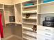 Large walk-in closet with ample shelving and hanging space at 32 Honeymoon Dr, Henderson, NV 89011