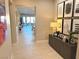 Bright and airy entryway with wood-look tile flooring and modern decor at 32 Honeymoon Dr, Henderson, NV 89011