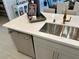 Kitchen island with double sink, dishwasher, and white quartz countertops at 32 Honeymoon Dr, Henderson, NV 89011