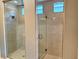 Spacious walk-in shower with frameless glass enclosure and stylish tile at 32 Honeymoon Dr, Henderson, NV 89011