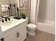 Modern bathroom with white vanity and hexagon tile floor at 36 Honeymoon Dr, Henderson, NV 89011