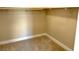 Spacious walk-in closet with wood shelving and carpet flooring at 36 Honeymoon Dr, Henderson, NV 89011