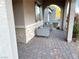 Covered porch with stone facade and comfortable seating at 36 Honeymoon Dr, Henderson, NV 89011