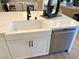 Farmhouse sink and dishwasher in a white kitchen island at 36 Honeymoon Dr, Henderson, NV 89011