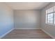Bedroom with neutral color scheme, baseboard trim and a window for natural light at 5409 Centurion Ct # 104, Las Vegas, NV 89122