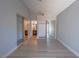 Bright bedroom features mirrored closet doors, light gray walls, and wood look laminate flooring at 5409 Centurion Ct # 104, Las Vegas, NV 89122