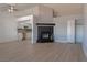 Spacious living room featuring a fireplace, wood floors, and open kitchen at 5409 Centurion Ct # 104, Las Vegas, NV 89122