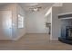 Bright living room with wood floors, fireplace, and a modern open kitchen at 5409 Centurion Ct # 104, Las Vegas, NV 89122