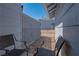 Cozy outdoor patio space with seating, privacy fence and desert landscaping at 5409 Centurion Ct # 104, Las Vegas, NV 89122