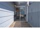 Small patio area with seating, and privacy fence outside of a sliding glass door at 5409 Centurion Ct # 104, Las Vegas, NV 89122