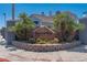 Attractive Duck Creek Village signage surrounded by landscaping and palm trees at community entrance at 5409 Centurion Ct # 104, Las Vegas, NV 89122