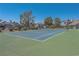 Community tennis court features a well maintained court and surrounding landscape at 5409 Centurion Ct # 104, Las Vegas, NV 89122