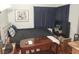 Cozy bedroom featuring a double bed, wooden coffee table, and dark blue curtains at 6409 Sierra Diablo Ave, Las Vegas, NV 89130