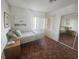 Cozy bedroom with wood flooring and mirrored closet at 6409 Sierra Diablo Ave, Las Vegas, NV 89130