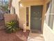 Inviting front entrance with a green door and landscaping at 6409 Sierra Diablo Ave, Las Vegas, NV 89130