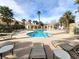 Community pool area with lounge chairs at 6409 Sierra Diablo Ave, Las Vegas, NV 89130