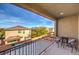 Enjoy outdoor living on this covered balcony with comfortable seating and neighborhood views at 6482 Twin Harbors Ct, Las Vegas, NV 89141