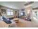 Upstairs living area providing a versatile space with comfortable seating and natural light at 6482 Twin Harbors Ct, Las Vegas, NV 89141