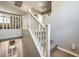 Carpeted staircase with white banister leading upstairs, with view of bathroom below at 6482 Twin Harbors Ct, Las Vegas, NV 89141