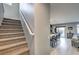 Carpeted staircase leading to the upper level of the home with an open view of the living area at 6482 Twin Harbors Ct, Las Vegas, NV 89141