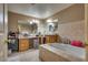 Bathroom with soaking tub, double vanity, and tile flooring at 7320 Bath Dr, Las Vegas, NV 89131