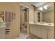 Bathroom featuring a double sink vanity, white cabinets, and tile flooring at 7320 Bath Dr, Las Vegas, NV 89131