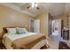 Bedroom featuring carpeted floors and access to an ensuite bathroom at 7320 Bath Dr, Las Vegas, NV 89131