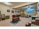 Living room with plush seating, wood accents, and a ceiling fan at 7320 Bath Dr, Las Vegas, NV 89131