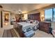 Bedroom with hardwood furniture, a ceiling fan, and a window for natural light at 7320 Bath Dr, Las Vegas, NV 89131